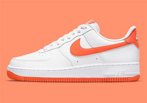 white orange nike shoes